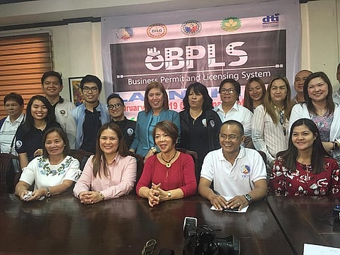 PAMPANGA. Mayor Anette Flores-Balgan, local BPLS Officer Rosanna dela Cruz and Municipal Administrator Jomel Cruz are joined by DILG Provincial Director Myrvi Fabia, DTI-Pampanga Provincial Director Elenita Ordonio and officials of DICT during Monday's launching of e-BPLS. (Princess Clea Arcellaz)
