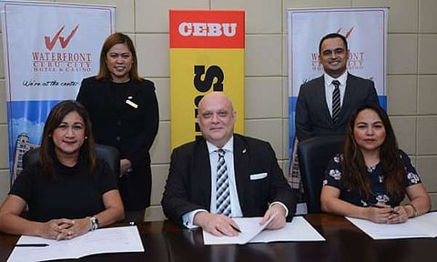 Signed and sealed. Best of Cebu head Anna Liza Yu (left, seated) and SunStar Marketing head Logane Echavez (right, seated) sign an agreement making Waterfront Cebu City Hotel the Best of Cebu party venue. Signing for the hotel is general manager Anders Hallden (center). Also present are Waterfront officers Arnel Aparis, marketing communications assistant, and Karen Hassi, marketing communications officer. (SunStar Photo/Amper Campaña)
