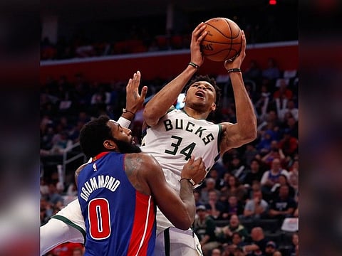 Milwaukee Bucks forward Giannis Antetokounmpo (34) is fouled by Detroit Pistons center Andre Drummond (0) during the first half of Game 4 of a first-round NBA basketball playoff series, Monday, April 22, 2019, in Detroit. (AP)