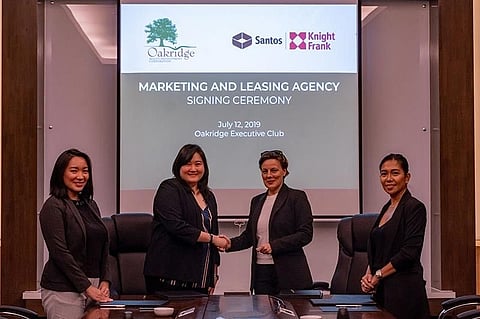 SEALED. From left, Oakridge Realty Development Corp. (ORDC) director for legal, finance and human resource Karen Climaco, ORDC director for sales, marketing and business development Anne Liu, Santos Knight Frank executive director Joanie Mitchell and director Idyll Ann Lacson sign a partnership agreement  for Oakridge IT Center 3's marketing and leasing activities. (Contributed Photo)