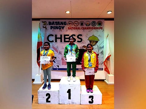 FIRST GOLD. Cagayan de Oro's Ruelle "Tawing" Canino (in the middle) takes the podium along with Mecel Angela Gadut (silver) of Candon City and April Joy Claros (bronze) of Angeles City in 12-under girls chess event of the 2019 Batang Pinoy National Finals in Puerto Princesa, Palawan, Aug. 26. (Contributed photo)
