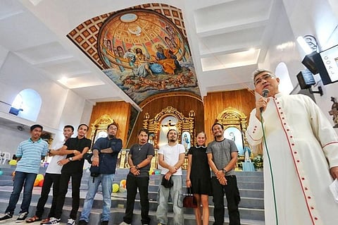 HEAVENLY CEILING. Msgr. Jaime Villanueva (holding microphone) of St. Francis Xavier Parish in Palompon town, Leyte presents the ceiling mural of the Dibuho Kisame collective on Friday, Nov. 22, 2019. With him are the artists who painted the ceiling: (from left) Dwyane Canoy, Charvin Orbeta, Benjo Tibalan, Alvin Philip Pastor, Cheno Encarnacion, Pierre Famador, Sheena Kristine Sumalinog and head artist Aris Avelino Pastor. (Alex Badayos)