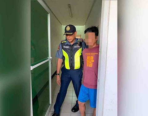 PAMPANGA. Pampanga 2nd Police Mobile Force Company (PMFC) Commander John Clark escorts rape suspect Rudy Yambao after the the suspect's arrest in Mexico town. (Ian Ocampo Flora)