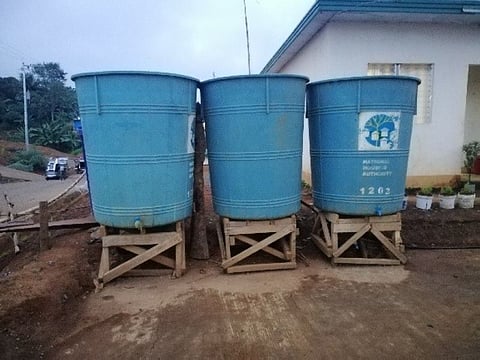 MARAWI CITY. The water reservoirs originally installed in the transitory houses but were removed by the residents so that the NHA water tanks can fill them (Riz Sunio).