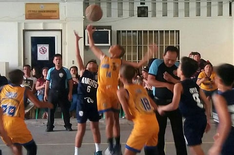 CAGAYAN DE ORO. The City Central dribblers in their memorable championship fight with the Corpus Christi School. The CCS Stingers prevail, 59-56. (Contributed photo)