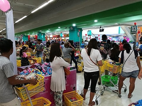 DAVAO. People flock to supermarkets to buy items and essential goods especially alcohol, face masks and disinfectant sprays. (Contributed photo)