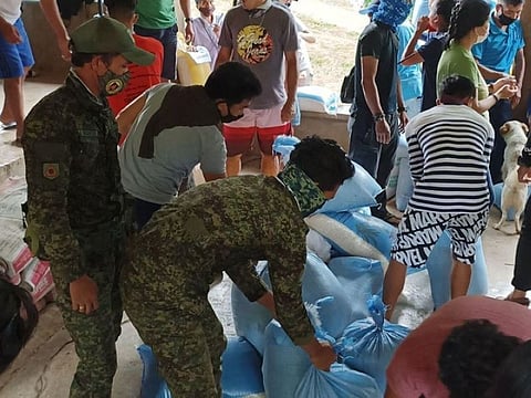 ZAMBOANGA. At least 113 families residing in the far-flung village of Sunop in Dumingag town, Zamboanga del Sur receive a sack of rice each. A photo handout shows 53rd Infantry Battalion troops assisting in the rice distribution. (SunStar Zamboanga)