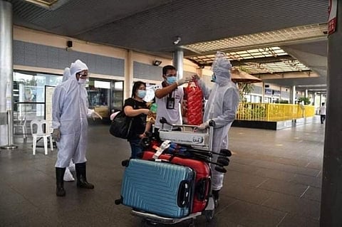 ARRIVAL. A total of 58 Bacolodnon LSIs have arrived at the Bacolod- Silay Airport Friday, August 28. DRRMO personnel immediately conducted disinfection of their bags and pieces of luggage upon disembarkation. (Photo courtesy of Bacolod City PIO)