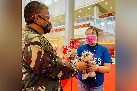 BEARS OF JOY. SM City Clark Public Relations Manager Venus Manalang gives Captain Jerson Sadsad of the 540 Air Base Group a pair of "Bears of Joy" as a way to honor their efforts in the fight against Covid-19. (Contributed photo)