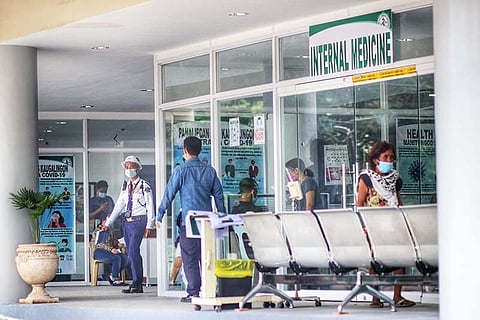 FUNCTIONING. Cebu City residents visit the internal medicine section of the outpatient department of the new Cebu City Medical Center (CCMC) on Tuesday, Feb. 2, 2021. The OPD became fully operational last Monday, Feb. 1. The department partially opened after the ribbon-cutting ceremony led by Mayor Edgardo Labella and other city officials on Dec. 28, 2020, but it closed again several times to give way for construction activities at the still unfinished CCMC building on N. Bacalso Ave. / AMPER CAMPAÑA
