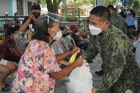 NEGROS. Nocppo Director Police Colonel Romy Palgue leads the PNP Heart's Day Gift-Giving at the public plaza of Talisay City recently. (Contributed Photo)