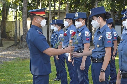 NEGROS. Negros Occidental Police Provincial Office Director Police Colonel Palgue gives roses to policewomen and female non-uniformed personnel as a gesture of appreciation for the contribution of women in the Philippine National Police during the kick-off celebration of National Women's Month at the Camp Alfredo M. Montelibano Sr. in Bacolod City Monday, March 1, 2021. (Contributed photo)