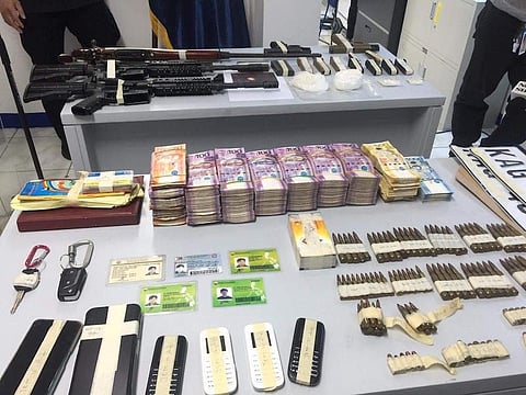 MANILA. Illegal firearms, ammunition, drugs and other items were seized from two vehicles believed to be owned by a former town mayor in  Maguindanao, who was also a former Special Action Force personnel. (Third Anne Peralta-Malonzo)