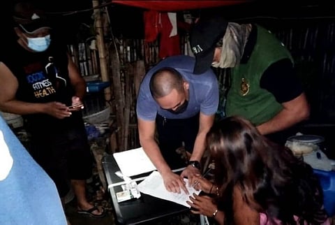 SAN CARLOS. Authorities arrest a female drug personality in a buy-bust operation in San Juan, Barangay 5, San Carlos City on June 22. (Contributed photo)