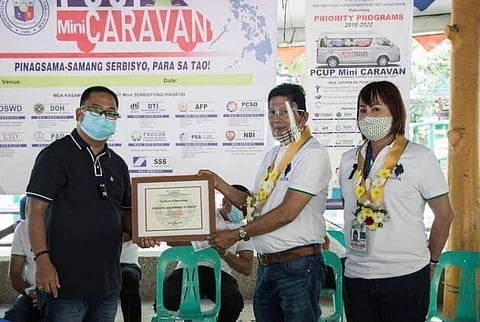 THANK YOU! Mayor Emmanuel Alejandrino and Executive Assistant to the Governor Madeth Alejandrino present a certificate of appreciation to PCUP Chairman Undersecretary Alvin Feliciano. (Contributed photo) 