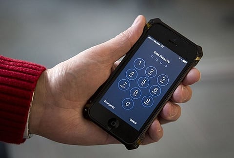 In this Feb. 17, 2016, file photo an iPhone is seen in Washington. At a time of widespread digital insecurity it turns out that the oldest and simplest computer fix there is — turning a device off then back on again — can thwart hackers from stealing information from smartphones. (AP Photo/Carolyn Kaster, File)
