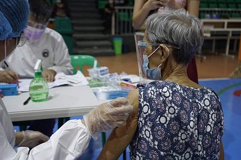 VAX FOR CHEMO, DIALYSIS PATIENT. An elderly woman, one of 45 chemotherapy and dialysis patients, gets jabbed under the Alagang Nanay: Health Care Delta program during vaccination at the Bren Z. Guiao Convention Center the other day. (Pampanga PIO)
