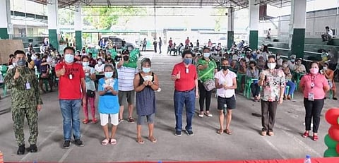 BACOLOD. City Mayor Evelio Leonardia and other officials during the first payout at the Banago  Elementary School I Gym in the city yesterday, September 22. (Contributed photo)