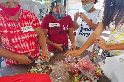     TRAINING. Household representatives of Baro beach residents in San Fernando, Cebu learn to make ecobricks from plastic waste. / CONTRIBUTED