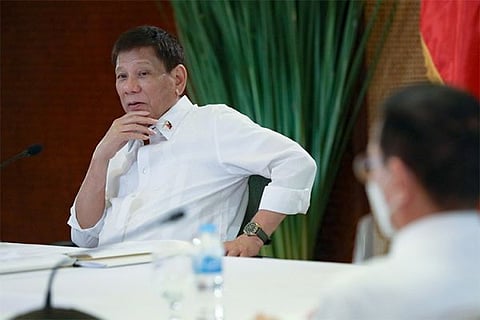 MANILA. Former President Rodrigo Duterte in this file photo talks to the people after holding a meeting with key government officials at the Malacañan Palace on March 7, 2022. 