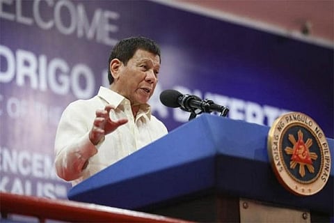 MANILA. In this file photom then-President Rodrigo Duterte delivers a message during the Philippine National Police Academy-Justice, Integrity, Service (PNPA) 43rd Commencement Exercises at the Campos Grandstand, Camp General Mariano N. Castañeda in Silang, Cavite on April 21, 2022.  