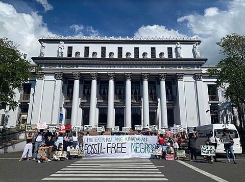 NEGROS. Youth and civil society organizations stage a silent protest at the Provincial Capitol of Negros Occidental in Bacolod City on Earth Day yesterday, April 22, against a proposed 300-megawatt LNG power plant in San Carlos City. (Youth for Climate Hope Photo)