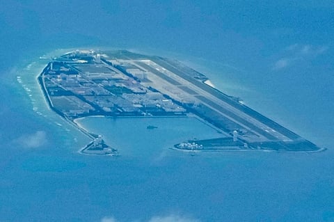 MANILA. Chinese structures and buildings on the man-made Fiery Cross Reef at the disputed Spratlys group of islands in the South China Sea are seen on March 20, 2022. (AP)