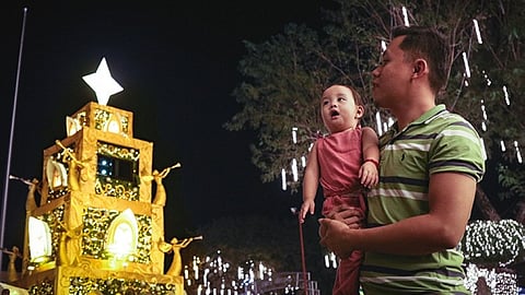 MASKLESS AT LAST. A father and son visits the opening of the Pasko Fiesta sa Davao 2022 in front of the Davao City Hall on Thursday evening, December 1. Davao City Mayor Sebastian Duterte announced during the event that he already signed a local ordinance supporting the Executive Order of President Ferdinand "Bongbong" Marcos, Jr. on the voluntary wearing of facemasks indoors. Earlier, the city already adopted the voluntary wearing of face masks outdoors. 