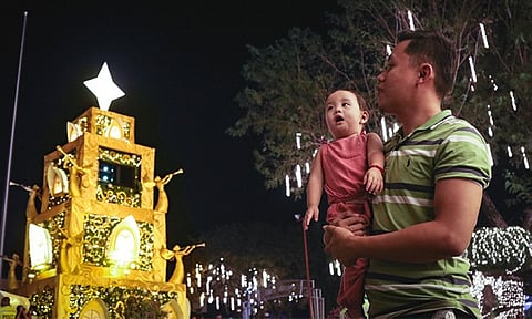 MASKLESS AT LAST. A father and son visits the opening of the Pasko Fiesta sa Davao 2022 in front of the Davao City Hall on Thursday evening, December 1, 2024. Davao City Mayor Sebastian Duterte announced during the event that he already signed a local ordinance supporting the Executive Order of President Ferdinand "Bongbong" Marcos, Jr. on the voluntary wearing of facemasks indoors. Earlier, the city already adopted the voluntary wearing of face masks outdoors.