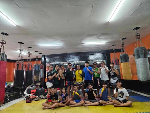 POSE. Mixed martial arts students pose for a photo in the gym. / CONTRIBUTED