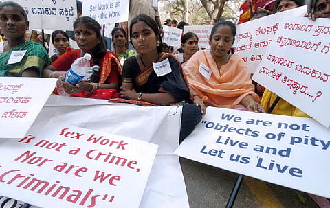 New Delhi, INDIA:  Indian sex workers hold placards as they take part in a rally in New Delhi, 08 March 2006 to mark the International Women's Day.  The protestors demanded social rights and the Immoral Traffic Prevention (ITP) Act to be scrapped.      AFP PHOTO/ MANAN VATSYAYANA  (Photo credit should read Manan Vatsyayana/AFP/Getty Images)