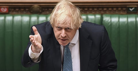 epa08419973 A handout photograph released by the UK Parliament shows British Prime Minister Boris Johnson during Prime Minister Questions at the House of Commons in London, Britain, 13 May 2020. (Photo: EPA-EFE/JESSICA TAYLOR/ UK PARLIAMENT)