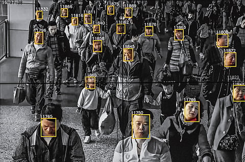 Monitors display a video showing facial recognition software in use at the headquarters of the artificial intelligence company Megvii, in Beijing, May 10, 2018. Beijing is putting billions of dollars behind facial recognition and other technologies to track and control its citizens. (Gilles Sabrié/The New York Times)