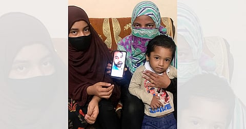 Family members of the ‘Al Qaeda’ terror-accused Mushiruddin, 44,  hold a photo of him over a month since his arrest by the UP ATS/Sabah Gurmat