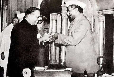 Dr. Babasaheb Ambedkar, Chairman, Drafting Committee of the Constitution, presenting the final draft of the Indian Constitution to the Chairman of the Constituent Assembly and President, Dr. Rajendra Prasad, on November 25, 1949.