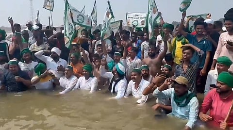 The farmers began their Jal Satyagraha by entering in the waters of the Yamuna River.