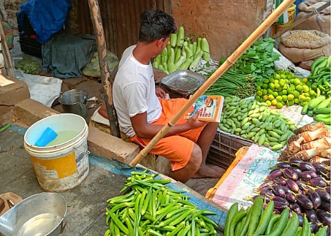 A vegetable vendor in Mukeri Bazaar. 