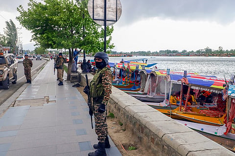 Security personnel deployed around the Dal Lake amid heightened security measures following the Pahalgam terror attack in Srinagar.