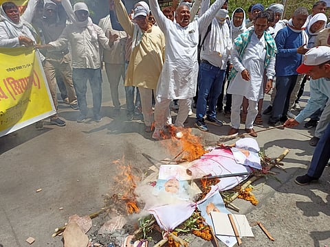 Demonstrators burnt an effigy and submitted a memorandum demanding the rollback of arbitrary deductions from summer vacations and action on other key demands.