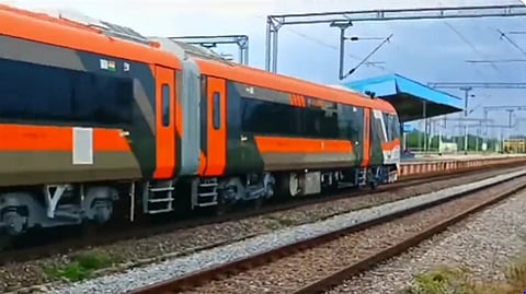 A  Vande Bharat train entering an unspecified railway station