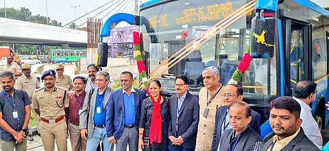 Rajeev Gowda with the feeder BMTC bus