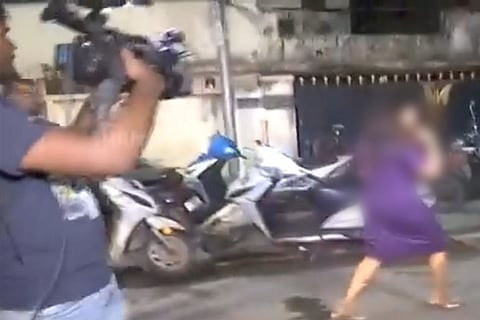 Women being chased by camerapersons at Chennai