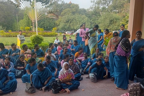 Sanitation workers protest at University of Hyderabad. 