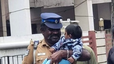 Head Constable Dayalan rescuing a toddler in the Chennnai Floods 2023
