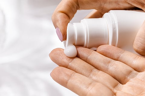 Person using a skincare product
