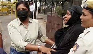 Police detaining the couple
