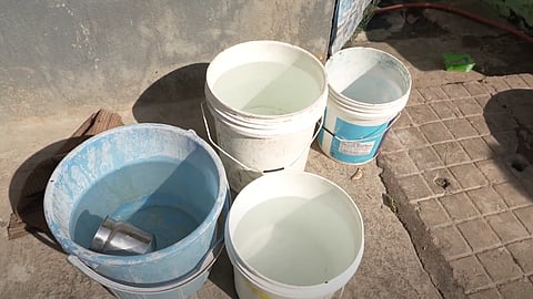 Water stored in small buckets. 