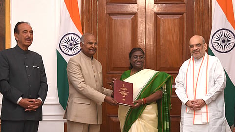 Former President Ramnath Kovind hands over the committee report to President of India Droupadi Murmu, in the presence of Home Minister Amit Shah and  former Leader of the Opposition in the Rajya Sabha Ghulam Nabi Azad.