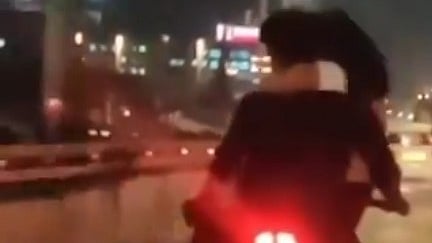 Screen grab from the video of the man and woman on the bike