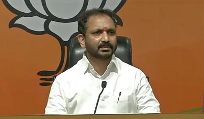 image featuring K Surendran wearing a white shirt. 